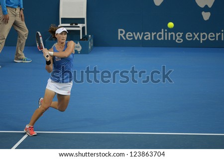 SYDNEY - JAN 7: Sam Stosur hits a backhand during her first round match in the APIA Sydney Tennis International. Sydney January 7, 2013.