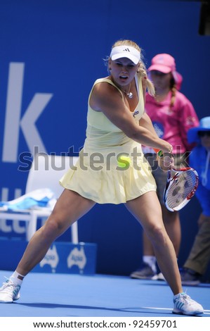 SYDNEY - JAN 10: Caroline Wozniacki hits a backhand in her opening round match in the APIA Tennis International. Sydney - January 10, 2012