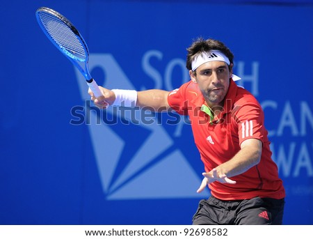 SYDNEY - JAN 10: Marcos Baghdatis prepares a forehand in his match at the APIA Tennis International. Sydney - January 10, 2012