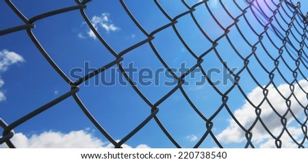 blue sky background and white clouds with wire fence