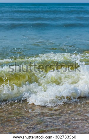 the waves on the shore of the Black Sea vertical photo