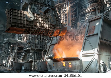 casting ladle and furnice at steel plant Imagine de stoc © 