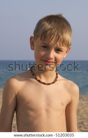 Portrait Of A Ten Years Old Blond Boy On The Beach Near The Sea Stock ...