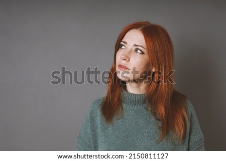 Image, Stock Photo thoughtful woman in turleneck sweater is looking up thinking or planning