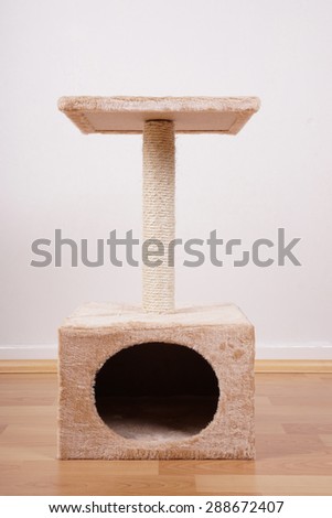 small cat tree or tower with hideaway scratching post and lookout platform