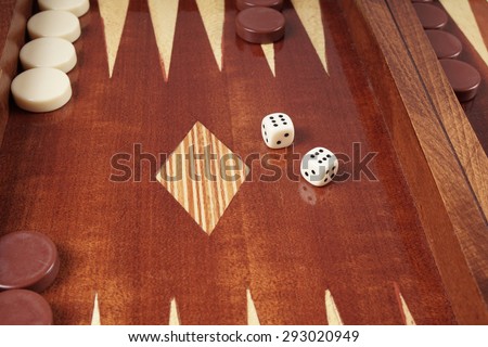 double six or boxcars, rolling dice on backgammon board game
