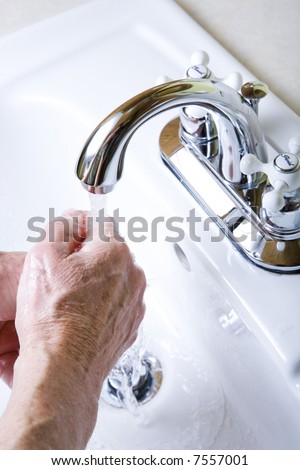 Senior women washing her hands