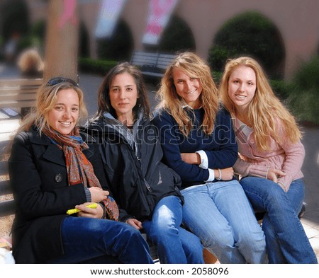 Group of sorority girls sitting on bench