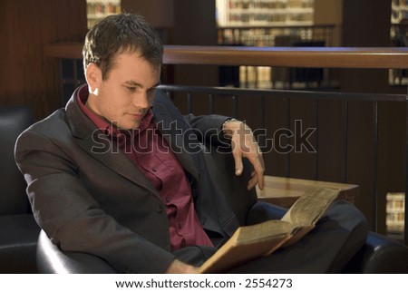 college student relaxing with a good book