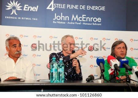 BUCHAREST, ROMANIA- APRIL 24: Mansour Bahrami, John McEnroe, Ilie Nastase, tennis legends, speak to the media during BRD Nastase Tiriac Trophy press conference, on April 24, 2012 in Bucharest, Romania