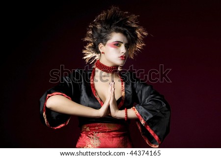 sexy woman wearing kimono and crazy hairstyle in studio