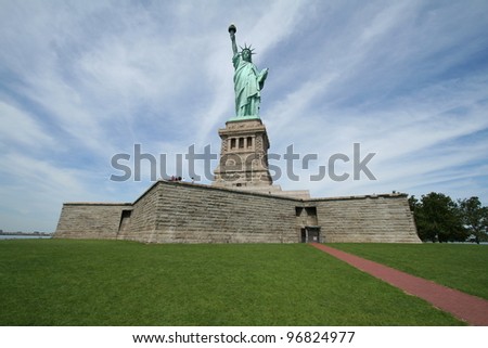 Lady Liberty with the background sky in a radiating pattern. Statue of Liberty.