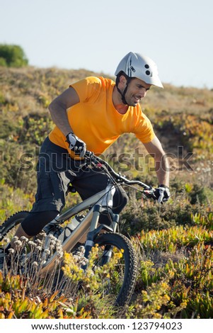Mountain biker riding dirt trail