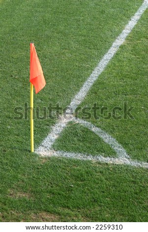 corner flag and football corner painted on the grass pitch