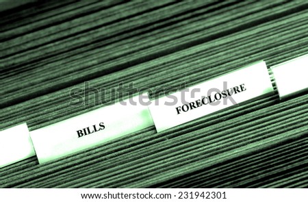 Detail of file folders for bills and foreclosure personal finances