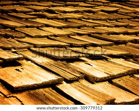 Detail of old wooden wood shingles on top of house home