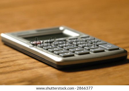 Detail closeup of a calculator on a desk top