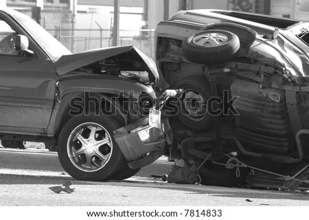 Car Wreck with Smashed Hood and Flipped Car