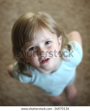 Portrait of a beautiful little girl looking at the viewer