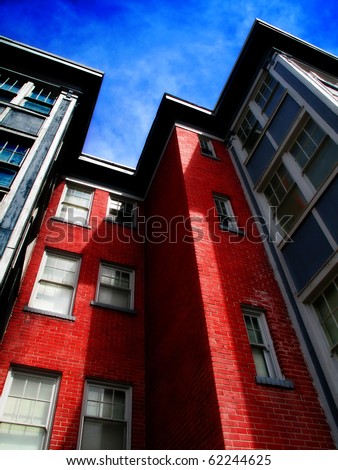 Rows of Apartment Buildings with Blue Sky in Background