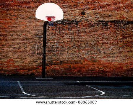 Urban basketball court in neighborhood with old buildings