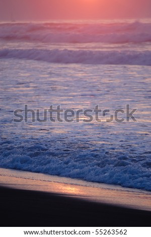 last rays of sun reflected in the sea and the beach sand. The shadow area has a cool tone in contrast with the warmth of the lights