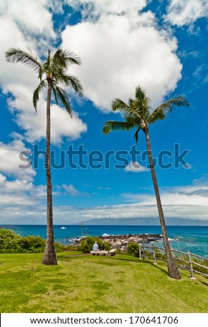 MAUI, HAWAII - SEPTEMBER 1, 2013: tourists enjoy ocean view in West Maui\'s famous Kaanapali beach resort area.
