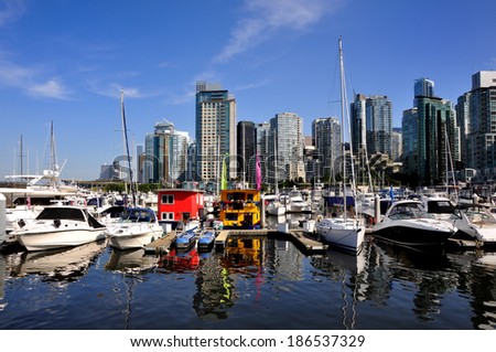 VANCOUVER, CANADA - AUGUST 11, 2011: view of Vancouver downtown and marina from Stanley park in Vancouver, British Columbia, Canada. Vancouver is the most densely populated Canadian municipality.