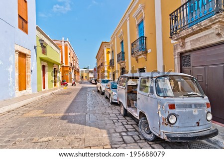 CAMPECHE, MEXICO - APRIL 19, 2014: downtown street with typical colonial buildings in Campeche, Mexico. The city was founded in 1540 by Spanish conquistadores atop pre-existing Maya city of Canpech