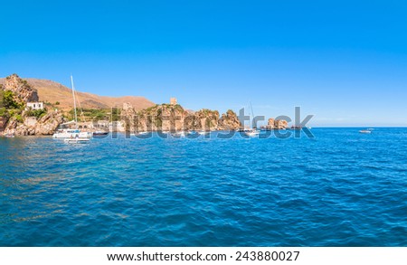 ZINGARO NATURAL RESERVE, ITALY - AUGUST 26, 2014: tourists enjoy blue mediterranean sea in Zingaro Natural Reserve, Italy. This National Park stretches along about 7 kilometers of unspoilt coastline.
