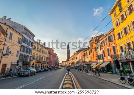 PARMA, ITALY - SEPTEMBER 10, 2014: day view of downtown main street with shops and citizens in Parma, Italy. Parma is famous for its prosciutto (ham), cheese, architecture and music