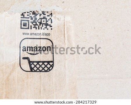 MILAN, ITALY - JANUARY 3, 2015: detail of delivered Amazon parcel in Milan, Italy. Amazon.com is the world\'s largest online retailer.