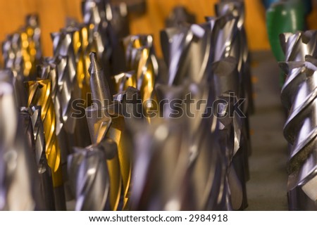 Drill bits and endmills placed down on a table