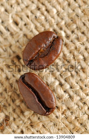 Coffee beans and coffee bean bag as background