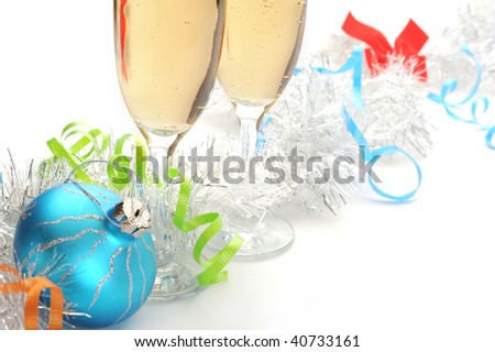 Champagne flutes and Christmas setting on white background