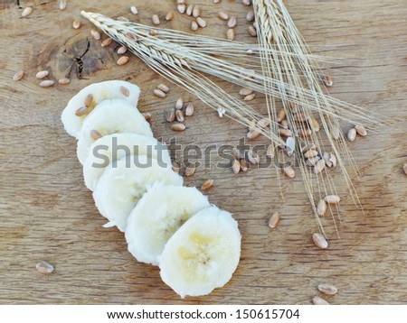not fresh, brown, banana on a oak board