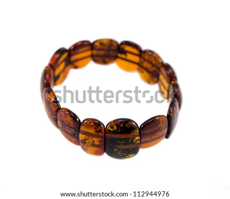 Amber stone bracelet isolated on white background. National lithuanian stone.