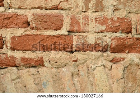 ancient vintage brick wall requires repair background closeup.