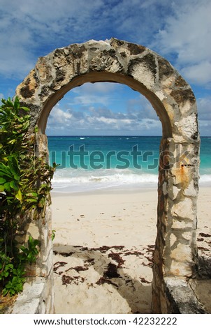 The stone arch, an entrance to Paradise beach on Paradise Island, The Bahamas.