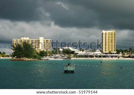 Heavy dark clouds over resort buildings in Ocho Rios town (Jamaica).