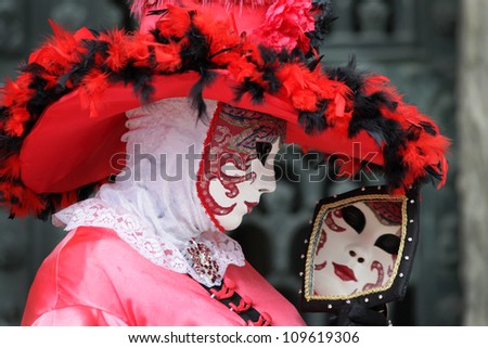 VENICE, ITALY - FEBRUARY  9: Unidentified person in Venetian mask at St. Marco Square, Carnival of Venice on February 9, 2010.
