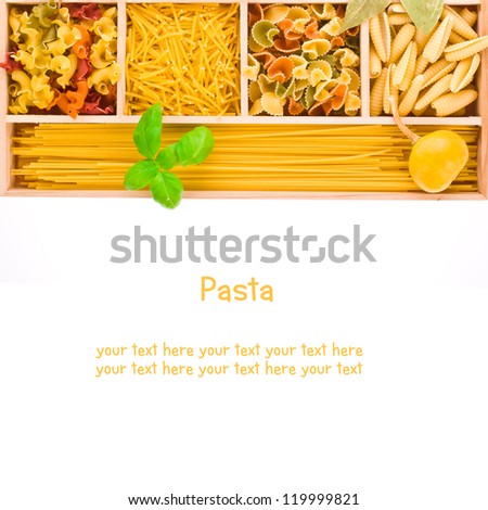 different types of pasta in a wooden box as a border isolated on white background.