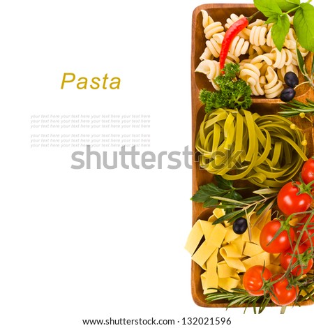 Italian pasta collection in wooden box decorated with tomatoes and herbs isolated on black background  with sample text