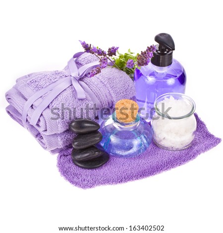 spa concept - towels and lavender flowers and stones isolated on white background isolated on white background