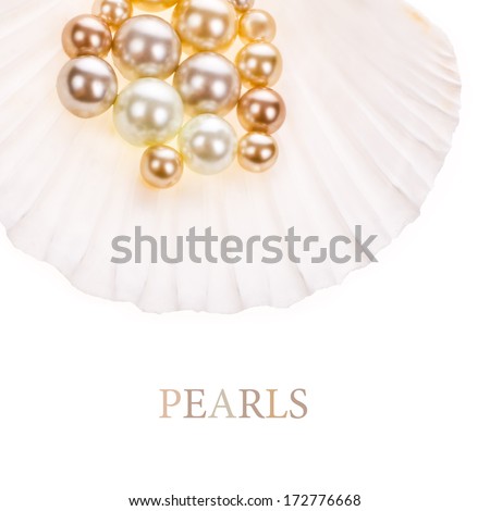 Big pearl in an oyster shell and small pearls ,  isolated on a white background .