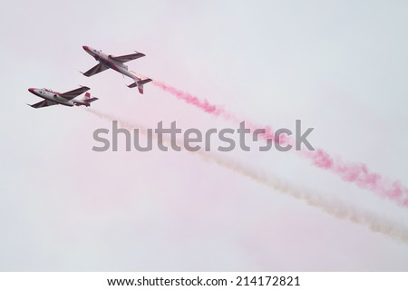 SLIAC, SLOVAKIA - AUGUST 30: Aerobatic Team of Air Force of Poland - White-Red Sparks at SIAF airshow in Sliac, Slovakia on August 30, 2014