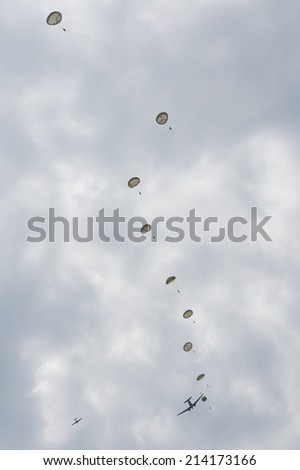 SLIAC, SLOVAKIA - AUGUST 30: paratroopers jump out of plane during SIAF airshow in Sliac, Slovakia on August 30, 2014