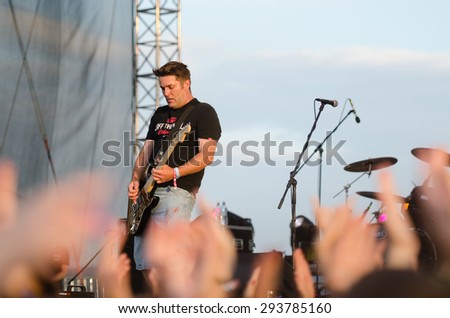 PIESTANY, SLOVAKIA - JUNE 28: Vratko Rohon - singer and guitarist of Slovak rock music group Ine Kafe performs on music festival Topfest in Piestany, Slovakia on June 28, 2015