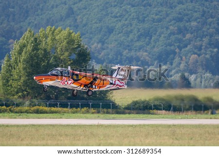 SLIAC, SLOVAKIA - AUGUST 30: Take off of SAAB 105 OE at SIAF airshow in Sliac, Slovakia on August 30, 2015