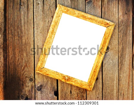 Empty old wooden frame on a wooden wall